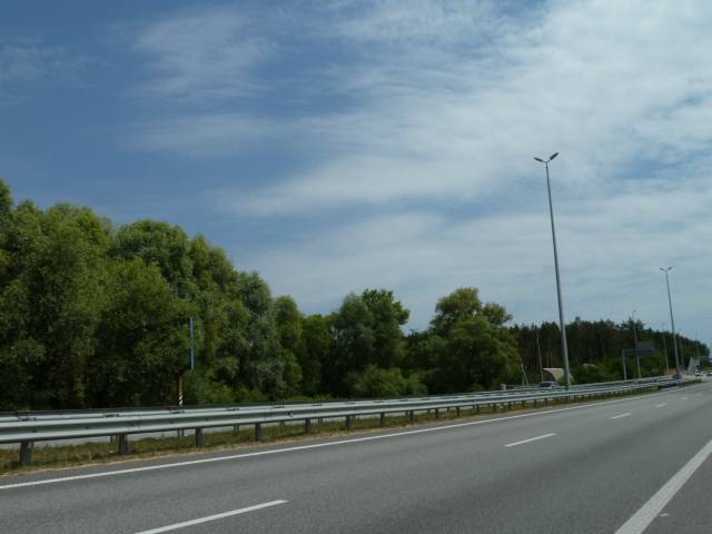Billboard Buzova,  s. Buzova, trasa M-06 "Kiiv-Cop" (Zitomir), km 35+200 pravo, za 250m do avtobusnoi zupinki ta povorotu na st. Lenina, cerez 600m pisla AZS BRSM-Nafta