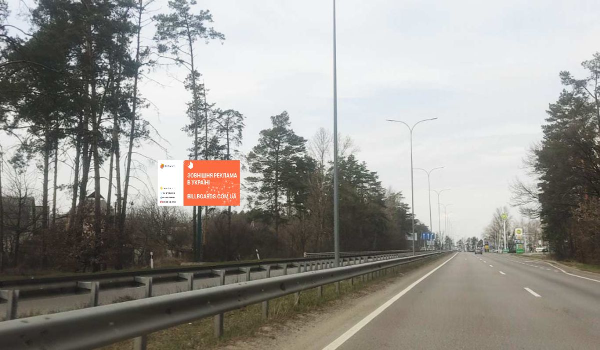 Billboard Vishgorod,  550 m. pisla povorotu z avtomobil'nou dorogi R-02 "Kiiv-Ivankiv-Ovruc" na avtomobil'nu dorogu R-69 "Kiiv-Visgorod-Desna-Cernigiv", u napramku st. Bogatirs'kij, m. Kiiv, pravoruc
