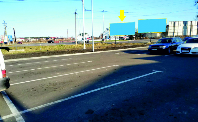 Billboard Zhovkva,  m. Zovkva, st. L'vivs'ka, 28, teritoria avtoparkovki ATB, prama vidimist' pri vihodi z dverej supermarketu, 24/7 velikij tranzit, miscevi ziteli + aglomeracia.