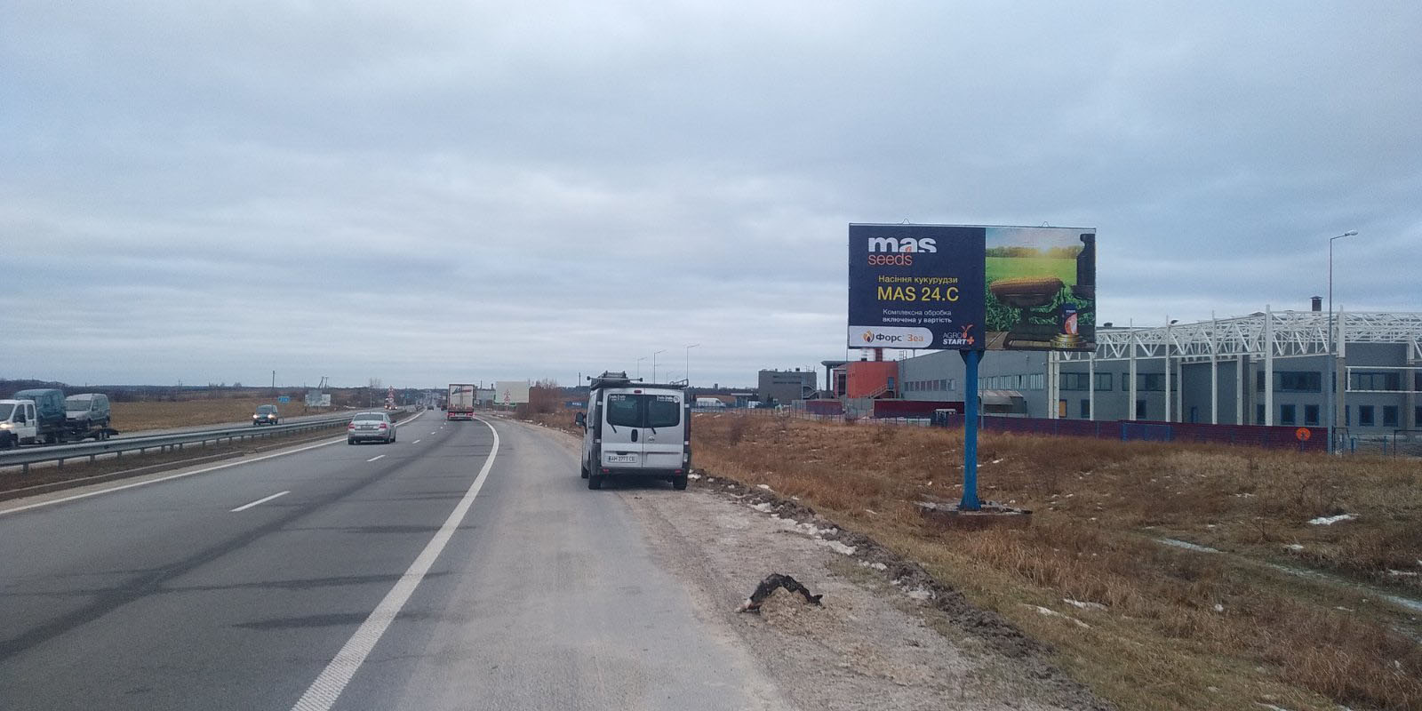 Billboard Zvyagel,  Ob"izdna Novograda. Bila zavodu Cersanit No 1.Pravoruc. Napramok z Zitomira na Rivne