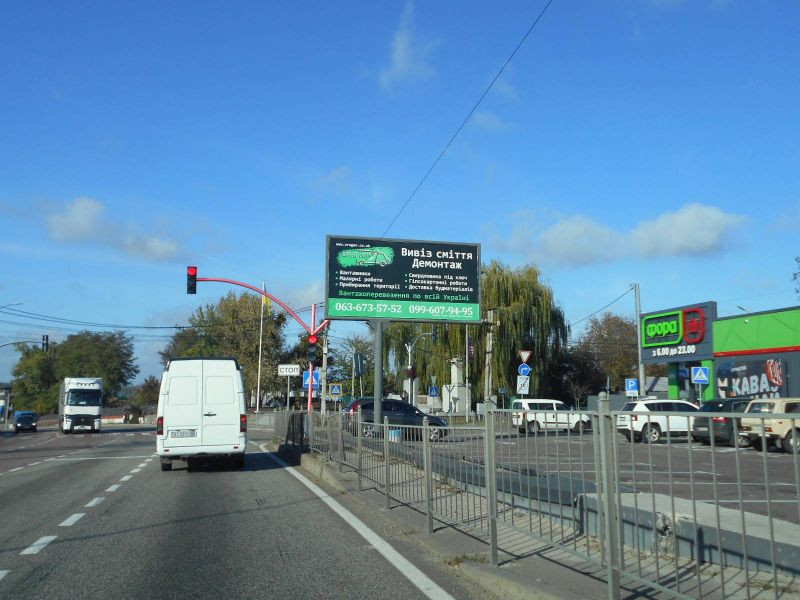 Билборд Гостомель,  смт. Гостомель, траса М-07 "Київ-Ковель", км 22+850 право, вул. Кулішова, 44 (вул. Садова, 2), перед поворотом на с. Горенка, парковка магазину "Фора"
