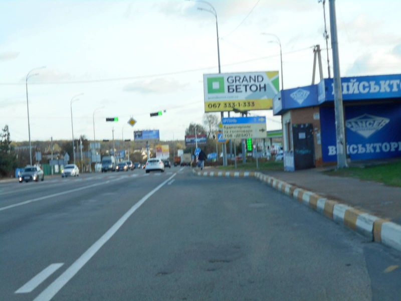 Billboard Gostomel,  м. Гостомель-м. Ірпінь, вул. Шевченка-вул. Свято- Покровська (навпроти №20-А), траса М-07, км 23+650 ліво, перед Ірпінським кільцем, біля Сіті Маркету, зупинка