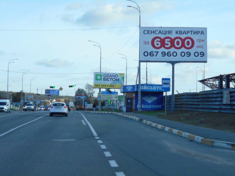 Billboard Gostomel,  м. Гостомель-м. Ірпінь, вул. Шевченка-вул. Свято- Покровська (навпроти №22-А), траса М-07, км 23+700 ліво, перед Ірпінським кільцем, біля Сіті Маркету, зупинка