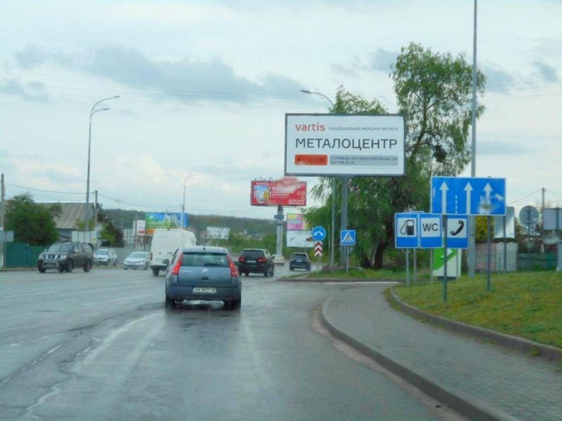 Billboard Gostomel,  м. Гостомель-м. Ірпінь, вул. Шевченка-вул. Свято- Покровська (навпроти №10), перетин з вул. Гайдамацька, траса М-07, км 23+550 ліво, біля АЗК ОККО, Сіті Маркет