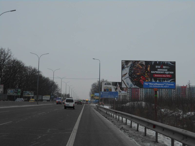 Билборд Гатное,  с. Гатне, траса М-05 Київ-Одеса, км 14+625 право, за 300м до заїзду у МЕГА МАРКЕТ ГАТНЕ, за 450м до повороту на Хотів, Гатне, Крюківщину