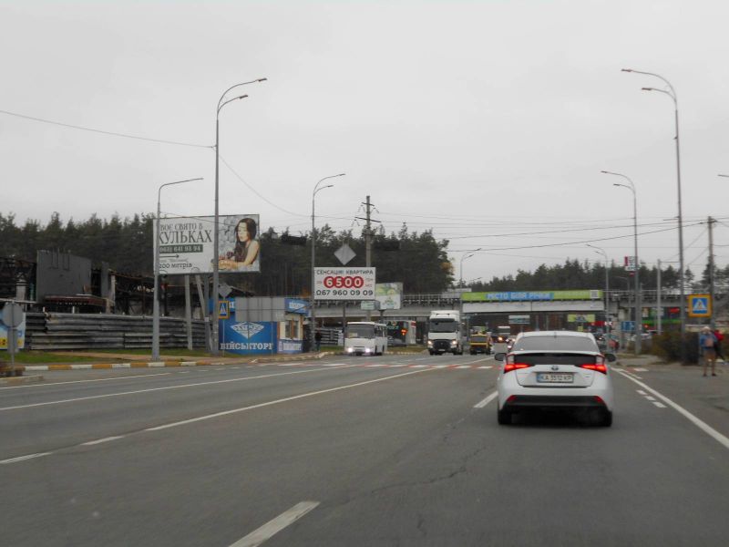 Billboard Gostomel,  м. Ірпінь-м. Гостомель, вул. Свято- Покровська (навпроти №20-А) - вул. Шевченка, траса М-07, км 23+650 ліво, перед Гостомельським кільцем, біля Сіті Маркету, зупинка