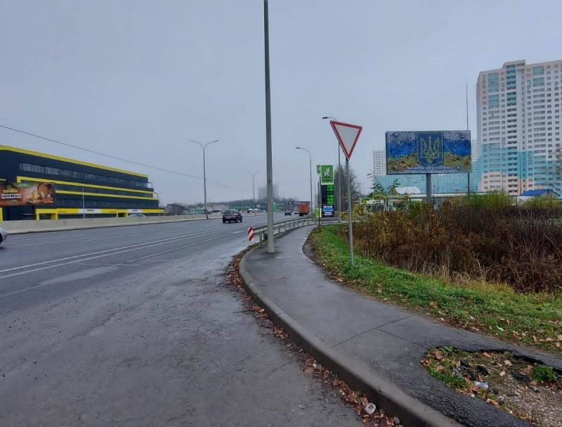 Билборд Гатное,  с. Чабани, початок проспекту Академіка Глушкова, траса М-05 Київ-Одеса, км 13+800 ліво, заїзд на АЗС ОККО, виїзд з Нової Лінії, навпроти представництво КЕРХЕР, АТБ