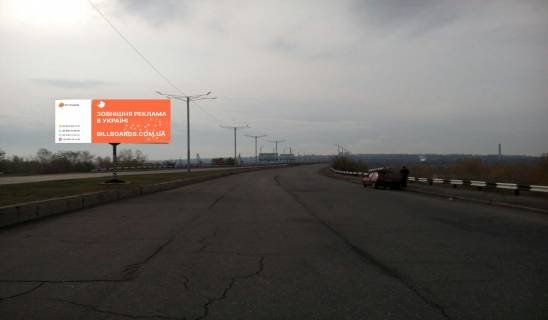 Билборд A в Каменское (Днепродзержинск), 6х3  мостовий перехід через р. Дніпро (на розділовій смузі)(5) рух з лівого на правий берег фото 1