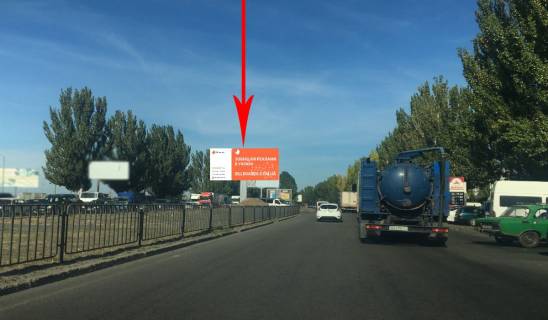 Билборд A в Днепр (Днепропетровск), 8х4  Донецьке шосе - вул. Березинська, навпроти ТРЦ "Караван", на розділовій смузі,  рух в сторону виїзду з міста фото 1