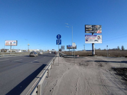 Билборд A в Киеве, 3х6  вул. В.Кільцева, виїзд з ЖК Щасливий (Софіївська Борщагівка) / NOVUS/ АЗС "UPG"- в напр. Одеської пл. (верхній) фото 2