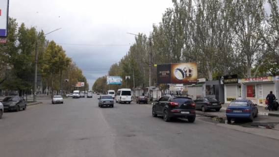 Билборд A в Мелитополе, 3х6  пр. 50 лет Победы перекрестка с ул. Гризодубовой (возле Рижского рынка), центр фото 1