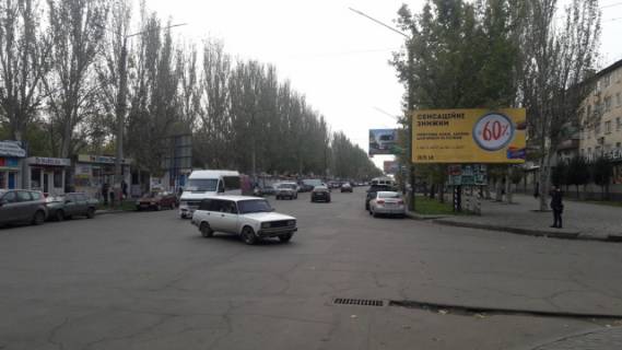 Билборд A в Мелитополе, 3х6  пр. 50 лет Победы перекрестка с ул. Гризодубовой (напротив Рижского рынка), центр фото 1