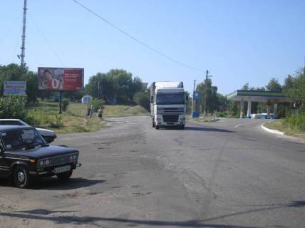 Білборд, Бігборд (Борд)  B у Ізюмі, 3х6  трасса, центр города (возле АЗС)  ул.Ростовский шлях Фото 1