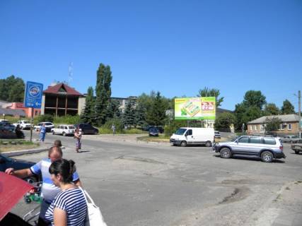Білборд, Бігборд (Борд)  B у Ізюмі, 3х6  центр, рынок   ул.Кап.Орлова-ул.Гагарина (перекресток) Фото 1