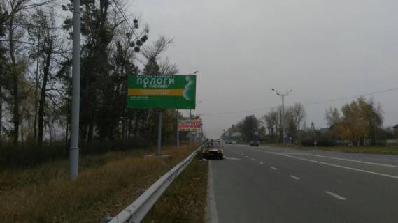 Билборд B в Вышгороде, 6x3  Трасса Киев-Иванков-Овруч,справа,развилка с ул.Богатырской направление Вышгород, с.Новые Петровцы фото 1