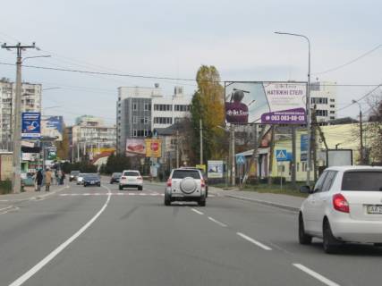 Нестандарт B у , траса Новообухівська (траса Новообухівська), 2х16  Н 01 Ново Обухівська тр. 23+432 км від КПП. Перший від Києва, світлофор, поворот на Ходосіївку, заїзд до МЕГАМАРКЕТ, ТРЦ Манафактура, АЗС Motto, в Київ Фото 1