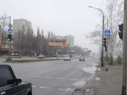 Білборд, Бігборд (Борд)  B у Запоріжжі Набережна магістраль  – вул.Пластова (Немировича-Данченка), "Рибацький стан", рух до вокзалу (призматрон) Фото 1