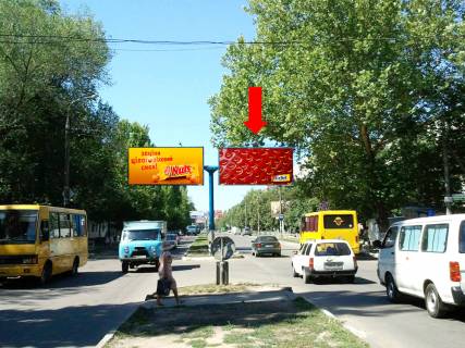 Билборд A в Херсоне, 3x6  Університетська вул. (кол. 40-річчя Жовтня вул.) / Миру вул., біля ринку "Дніпровський", роздільник, в центр, права фото 1