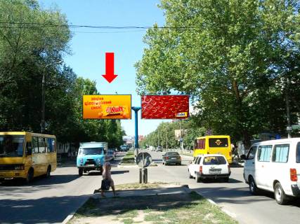 Билборд  в Херсоне, 3x6  Університетська вул. (кол. 40-річчя Жовтня вул.) / Миру вул., біля ринку "Дніпровський", роздільник, в центр, ліва фото 1