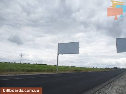 Білборд, Бігборд (Борд)  B у Харкові Окружна дорога (траса М-03 км 13 + 440 ліва), з'їзд з просп. Аерокосмічний (Гагаріна) в сторону просп. Героїв Харкова (Московський), ХТЗ Фото 1