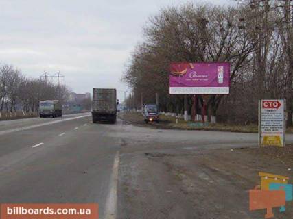 Білборд, Бігборд (Борд)  A у Одесі Новомиколаївська дорога, біля АЗС "ОККО", навпроти ТРЦ "Суворовський", супермаркету "Таврія В", в центр Фото 1
