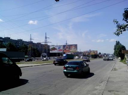 Billboard A in Dnipro (Dnipropetrovsk), 6х3  Donec'ke sose - st.Berezins'ka (pered povorotom na TRC Karavan), do centru, livoruc Photo 1