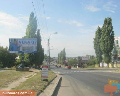 Білборд, Бігборд (Борд)  B у Рівному, 3х6  м. Рівне вул. Шухевича 12, навпроти автозаправки “OKKO” та перехресті вулиць Шехевича/Андрія Мельника, неподалік офісний центр Фото 1