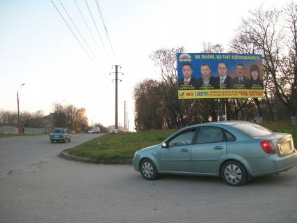Билборд A в Каменец-Подольском, 3х6  Нігинське шосе 34 (західна сторона) навпроти будинку №49 фото 1