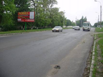 Billboard B in Kam'yanets-Podilsky, 3х6  Nigins'ke sose (zahidna storona) za 100 metriv do perehresta z st.Pivnicnou Photo 1