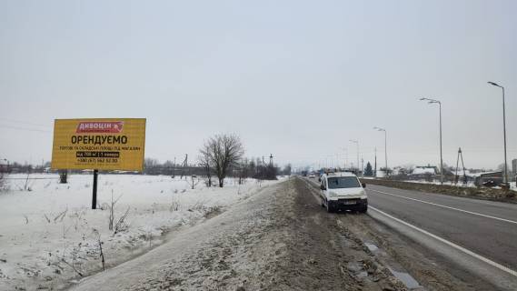 Билборд B в Буськ, 6x3м.  поряд АЗК ОККО, центральний вїзд в м. Буськ з сторони Львова, на м.Броди, траса Львів - Київ (Е-40) + жовта вітрозахисна люмінесцентна рамка фото 1