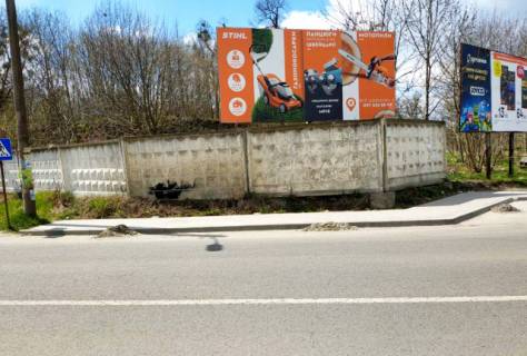 Billboard A in Kamyanka-Buzka, 6x3м.  m. Kam'anka - Buz'ka, centr, st. L'vivs'ka, central'na avtostancia, prama vidimist' z platform ocikuvanna, intensivnij ruh Photo 1
