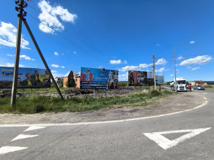Билборд A в Жовкве, 6x3м.  автокільце, вул. Львівська, центральний вїзд в місто + на кордон з Польщею, на м. Червоноград, траса Львів- Рава-Руська (М-09) + на АТБ фото 1