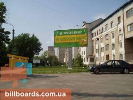 Білборд, Бігборд (Борд)  A у Києві, 6x3  Броварський проспект розподілювач (зупинка Військове містечко), рух в напрямку Броварів Фото 1