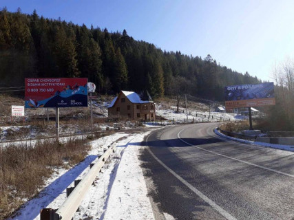 Билборд B в Микуличине, 3x6  Траса Н-09 Мукачево-Львів, 300 м після готелю Гердан, в`їзд у селище, напрямок руху на Буковель фото 1