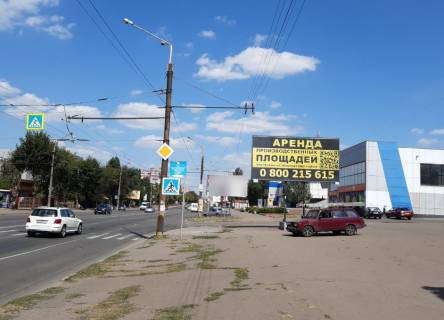 Билборд A в Кривом Роге Володимира Великого вул. (кол. Мелешкіна),к-тр Олімп, Аптека, торгові точки, Ескоріал, лікарня №4 напрямок руху до  пл. 30-річчя Перемоги фото 1