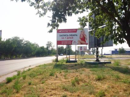 Билборд A в Кривом Роге Леоніда Бикова вул. (кол. Лепешинської), 31, заїзд до стоянки ТЦ "Метро". Напрямок руху до ТЦ Епіицентру, ТЦ Метро, АЗС Сентоза и РЛС. Напрямок руху транспорту від об’їздної до пл. Поля фото 1