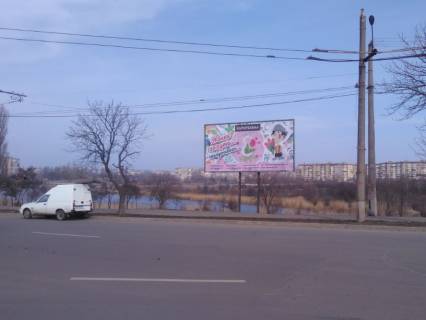 Білборд, Бігборд (Борд)  A у Кривому Розі пл. 30-річчя Перемоги, 1, кільце,  напрямок руху по кільцю з Сонячного та з площі Поля до Ювілейної. Фото 1