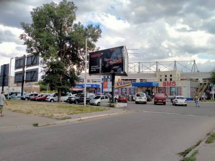 Білборд, Бігборд (Борд)  A у Кривому Розі вул. Героїв АТО (Димитрова), 30а заїзд до парковки перед ТЦ Сільпо. Напрямок руху від пр. Металургів до вул. Костенко. Фото 1