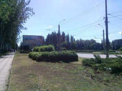 Білборд, Бігборд (Борд)  B у Кривому Розі вул. Дніпр шосе, 24 - вул. Телевізійна. Напрямок руху до Автовокзалу. Довгінцііська районна адміністрація, гост.Дружба, Тролейбусне депо. Фото 1