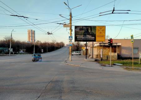 Білборд, Бігборд (Борд)  A у Кривому Розі  вул. С.Колачевського 23-го Лютого,32, зуп. Сурикова, напрямок руху до 17 кв в півнчні райони міста Фото 1