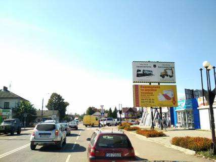 Билборд A в Коломые пр. Грушевського, перед кільцем 2-хповерх, низ (напрям на Ів.-Франківськ) фото 1