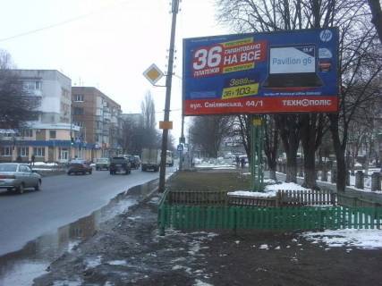 Білборд, Бігборд (Борд)  A у Василівці, 3х6  (Рс 6А) Ильина, 248А вход в парк 1 Мая и Свято-Троиц Собор, маркет "Гранд-маркет", центр. рынок Фото 1