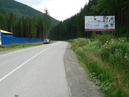 Билборд A в Буковеле, 3x6  Траса Н-09 Мукачево-Львів, дорога від Буковеля до Івано-Франківська (с.Поляниця), навпроти перевернутої хати, сувенірний ринок, 3 км 900 м від Буковеля, напрямок руху на Івано-Франківськ фото 1