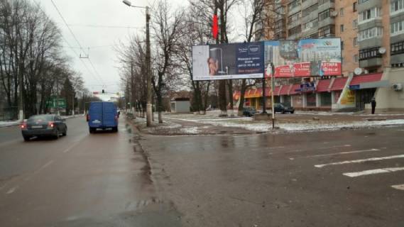 Білборд, Бігборд (Борд)  A у Житомирі Покровська вул. (Щорса вул.), 94 (лівий), (супер-маркет "ВОПАК", Управління патрульної поліції у м. Житомирі, ЖК "Капучіно", Агротехнічний коледж), в напрямку з міста Фото 1
