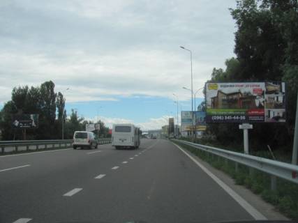 Билборд A в Ходосовке, 6x3  Новообухівська траса (Дніпровське шосе), перед АЗС "БРСМ", з м.Києва, в напрямку Мегамаркета, ТЦ "Мануфактура", кінотеатра "Баттерфляй", 7км+100м фото 1
