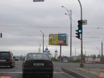 Білборд, Бігборд (Борд)  A у Києві вул. Драйзера / вул. Бальзака - на світлофорі, с / м Сільпо, Фокстрот, Космо (ТЦ Сіріус), працює на 2 трансп. потоку (в напрямку Св.-Троїцького собору) Фото 1