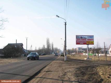 Білборд, Бігборд (Борд)  A у Києві, 3х6  Васильків, вул. Декабристів, 117 / ринок "Западинська", автосалон Lada; за пов. на вул. Миколи Бурки / перед пов. на вул. Космонавтів та вул. Тургенєвську, напрямок - в центр (з Києва) Фото 1