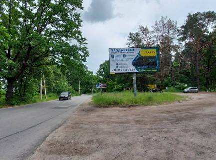 Билборд A в Украинке, 6х3  м. Українка, вул. Київська, км 2+950 право, поворот на с. Плюти, автобусна зупинка, перед котеджним містечком "ПЛЮТОВО" фото 1
