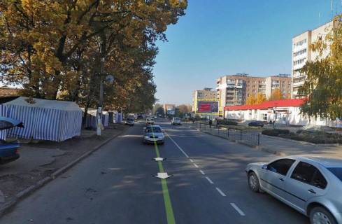 Билборд A в Умане м. Умань, вул. Тищика, 13а, біля відділення Нової Пошти №7, через 90м після магазину АТБ та 145м після повороту на вул. Грушевського, за 170м до автобусної зупинки та повороту на вул. Горького фото 1