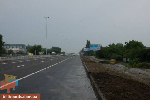 Billboard A in With. Mila, 6х3  s. Mila, trasa M-06 "Kiiv-Cop" (Zitomir), km 26+200 livo, pered povorotom na s. Petruski, navproti restoranu "Kozacok", magazin "Fora" scheme
